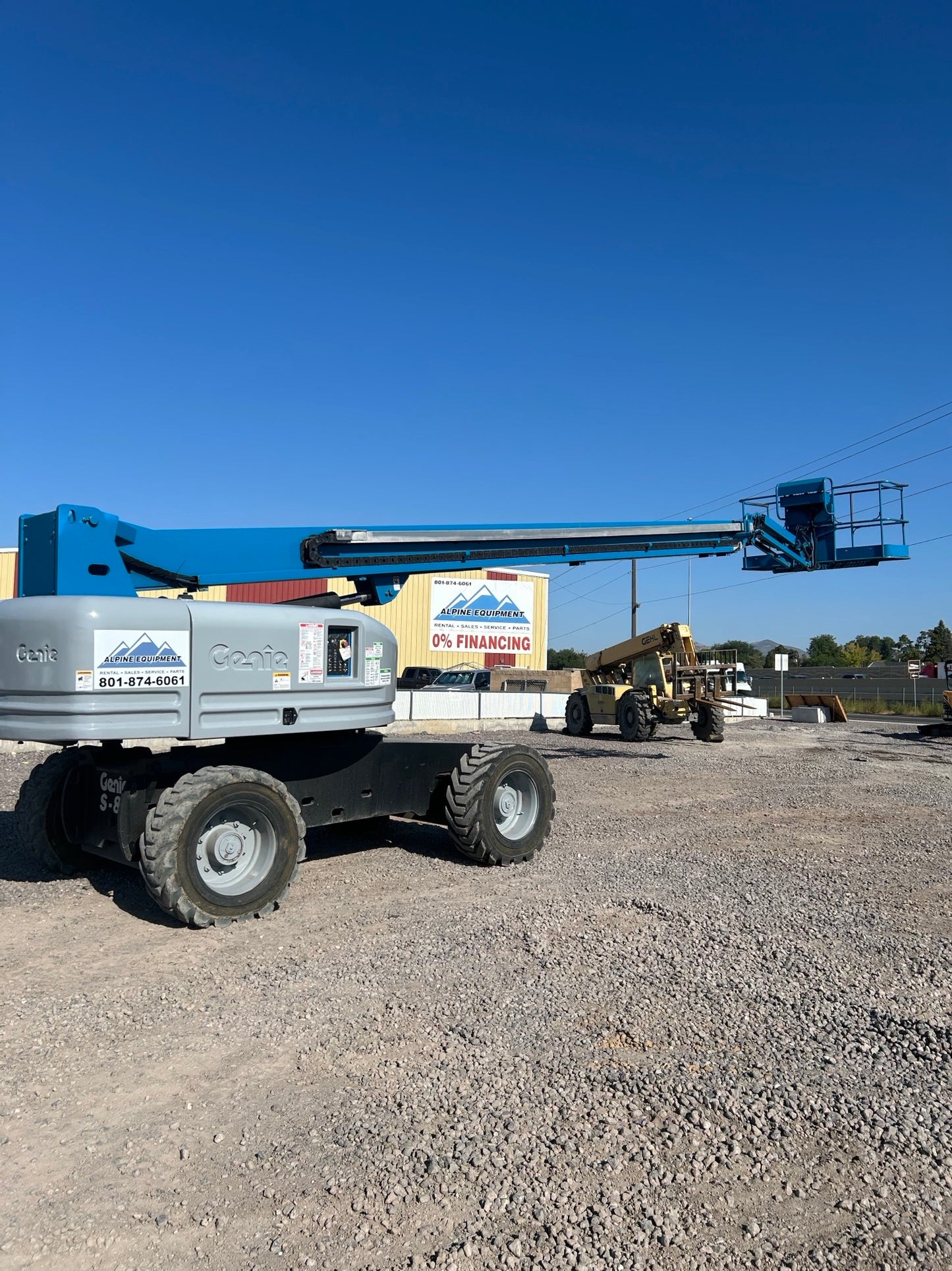 Heavy-duty 85-foot telescopic boom lift equipment for high-reach construction and industrial rentals.