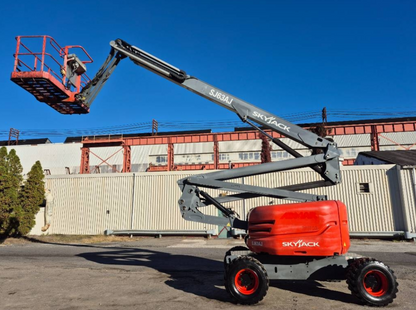 The automotive tire and wheel of the SJ63AJ SKYJACK 60' articulating boom lift.