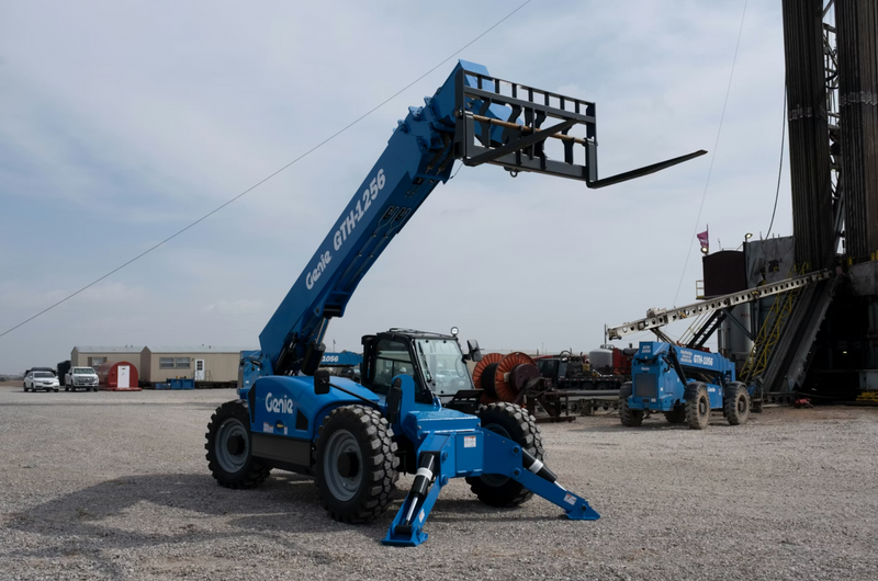 Rugged automotive tire and wheel on a 12K REACH telehandler for construction and roofing projects.