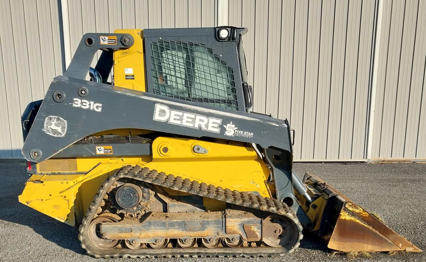 Rental 3100 lb operating capacity track skid steer, a compact heavy equipment machine for grading and loading